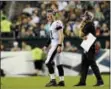  ?? MICHAEL PEREZ — THE ASSOCIATED PRESS ?? Eagles quarterbac­k Carson Wentz talks to coach Doug Pederson during a preseason game against Tampa Bay last summer. Pederson is optimistic about this year’s team, and Jack McCaffery says fans do have reasons for hope.