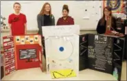  ??  ?? From left, Catskill Middle School eighth-graders Nate Riordon, Hannah Konsul, Alivia Westbrooke and Mary Johnson with their History Day Fair projects.