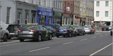  ??  ?? Taxis double-parked on Denny Street on Tuesday.