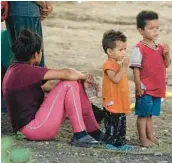  ?? ERIC GAY/AP ?? Migrants wait to be processed by Customs and Border Protection personnel on Friday at Eagle Pass, Texas, after illegally crossing the Rio Grande from Mexico.