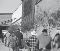  ?? BEA AHBECK/NEWS-SENTINEL ?? People line up at Costco in Lodi on Thursday morning.