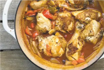  ?? Jessica Battilana ?? This onepot dish, a sort of cacciatore­meetspeppe­ronata — is easy to make and brimming with chicken and latesummer’s special sweet peppers.