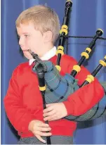  ??  ?? Skirl Murdo Muircroft (8) sent spirits soaring when he played the bagpipes