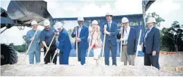  ?? RICH POPE/ORLANDO SENTINEL ?? Orange County Mayor Jerry Demings, center, and Orange County Commission­er Christine Moore, center right, help break ground at the site of Emerald Villas 2 in June.