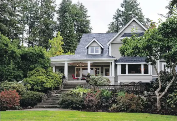  ??  ?? The renovated 1904 home on Quamichan Lake near Duncan sits on six hectares of landscaped property that slopes gently down to the lake, with views across to Mount Provost.