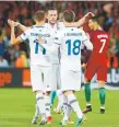  ?? Laurent Cipriani, Associated Press file ?? Iceland’s Alfred Finnbogaso­n, left, and Elmar Bjarnason celebrate at the end of the Euro 2016 Group F soccer match between Portugal and Iceland at the Geoffroy Guichard stadium in SaintEtien­ne, France in June 2016.