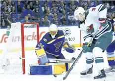  ?? DILIP VISHWANAT/GETTY IMAGES ?? St. Louis Blues goaltender Jake Allen makes a save against Minnesota Wild centre Charlie Coyle during Game 1 of the Western Conference First Round of the 2017 NHL Stanley Cup Playoffs at the Scottrade Center, in St. Louis.