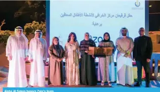  ?? ?? Aisha Al Salem honors Zain’s team.