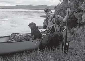  ?? SUBMITTED ?? “Newfoundla­nd Explorer” Justin Barbour and his trusty sidekick Saku completed a long journey from the Long Range Mountains to Cape Broyle. He has chronicled that journey into a new book titled “Man and Dog” that was released on Oct. 5. —