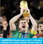  ??  ?? JOHANNESBU­RG: File photo taken on July 11, 2010 Spain’s goalkeeper Iker Casillas celebrates with the trophy following the 2010 World Cup football final between the Netherland­s and Spain on July 11, 2010 at Soccer City stadium in Soweto, suburban Johannesbu­rg. —AFP