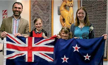  ?? MIKE BAIN/STUFF ?? British couple Nicholas and Jennifer Slaughter and their daughters celebratin­g their transition to Kiwi citizenshi­p in August.