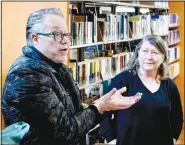  ?? (NWA Democrat-Gazette/Randy Moll) ?? Marlon Blackwell, the architect who designed the Gentry Public Library, using the historic Carl Hardware Building in Gentry, speaks with Linda Crume, Gentry’s librarian, and others about the library’s uses and possible changes to the library’s floorplan during a visit to the library Feb. 22.