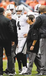  ?? MATTHEW STOCKMAN — GETTY IMAGES ?? Raiders quarterbac­k Derek Carr was helped off the field on Sunday and expected to miss 2-6 weeks after suffering what was diagnosed as a transverse process fracture in his back. But he was at practice Thursday and left tackle Donald Penn said Carr was...