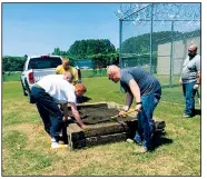  ?? Special to the Democrat-Gazette/JONATHAN PICKERING ?? Youth and officers at White River Juvenile Detention Center participat­e in a gardening project as part of programs designed to help incarcerat­ed kids improve.