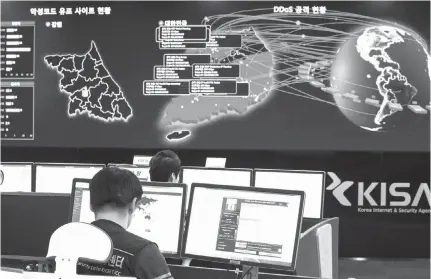  ?? Associated Press file photo ?? ABOVE: Employees watch electronic boards to monitor possible ransomware cyberattac­ks at the Korea Internet and Security Agency on May 15 in Seoul, South Korea. Unable to rely on good human behavior, computer security experts are developing software...