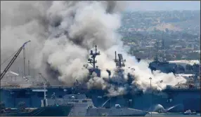  ?? (AP file photo) ?? Smoke rises from the Uss bonhomme richard on July 12, 2020, at naval base san diego.