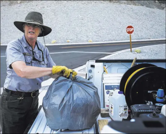  ?? Chase Stevens Las Vegas Review-Journal @csstevensp­hoto ?? “Some people are going to care, and some people aren’t. It’s discouragi­ng to see the mess they make sometimes,” says custodian Terry Eddington about the amount of trash left behind by visitors to Death Valley National Park, Calif.