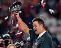  ?? AP ?? A rare Tom Brady football card from the first of his seven Super Bowl titles fetched $118,000 at an auction recently.