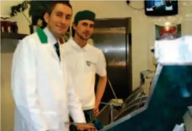  ??  ?? Frying high: Boon behind the counter of the Mermaid fish and chip shop with a colleague