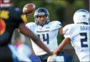  ?? MARK PALCZEWSKI/FOR DIGITAL FIRST MEDIA ?? Marquez McCray (14) of St. Joseph’s Prep on the Pennsylvan­ia all-stars tries to escape the Maryland pass rush in the 61st PSFCA Big 33 Football Classic at Central Dauphin Middle School in Harrisburg, PA on Saturday, June 16, 2018.