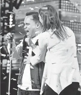  ?? TRAE PATTON/NBC ?? Singer Kodi Lee, left, gets a hug from his mother, Tina, after advancing. He will return for the first live show Tuesday.