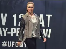  ?? MICHAEL REAVES, GETTY IMAGES ?? Ronda Rousey, above, promoted her bout with Amanda Nunes in New York on Nov. 11 but has been mostly silent recently.