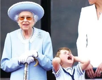  ?? ?? Britain’s Queen Elizabeth and Prince Louis appear on the balcony of Buckingham Palace as part of Trooping the Colour parade during the Queen’s Platinum Jubilee celebratio­ns in London. Picture: Reuters