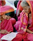 ?? PTI ?? An elderly woman going to a special school for grandmothe­rs in Fangane village. On right, women learn the Devnagri script. —