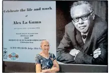  ?? District Six Museum ?? BLANCHE La Guma in front of an image of her late husband and fellow anti-apartheid Struggle icon Alex La Guma. l