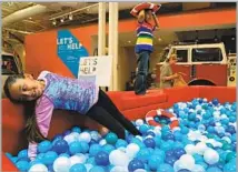  ?? Claire Collins Los Angeles Times ?? THE CAYTON CHILDREN’S MUSEUM’S ball pit provides a play break for Hayley Alvarez, 7, and Nicholas Valladares, 6.