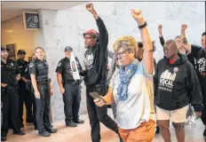  ?? AP PHOTO ?? Protesters opposed to President Donald Trump’s Supreme Court nominee, Brett Kavanaugh, demonstrat­e in the Hart Senate Office Building on Capitol Hill in Washington Thursday.