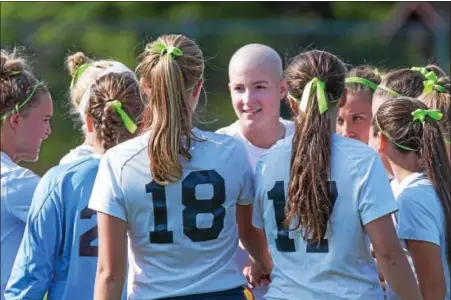  ?? DENNIS KRUMANOCKE­R — FOR DIGITAL FIRST MEDIA ?? Kutztown senior Niki Nolte, facing, huddles up with the Cougars’ girls soccer team before their cancer awareness game on Sept. 11 against Oley Valley. Players wore green ribbons in support of anyone fighting Non-Hodgkin’s Lymphoma and in honor of Niki.