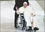  ?? ALESSANDRA TARANTINO/AP ?? Pope Francis arrives in a wheelchair to attend an audience with nuns and religious superiors in the Paul VI Hall at The Vatican, on Thursday.