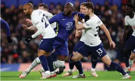  ?? Photograph: Marc Atkins/Getty Images ?? Romelu Lukaku (centre) tussles with Spurs’ Ben Davies (right), who was unfortunat­e in scoring an own goal for Tottenham.