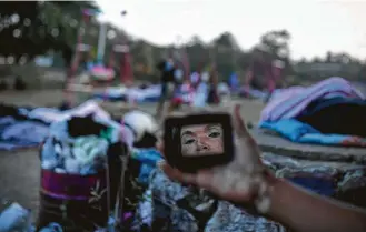  ?? Felix Marquez / Associated Press ?? Migrants in the “Stations of the Cross” caravan camped Tuesday in Matias Romero, Mexico. They have little means of reaching the U.S. even as President Donald Trump tweeted threats to Mexico.