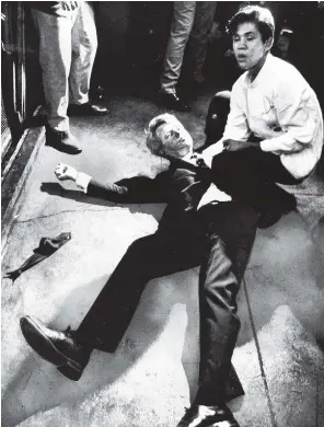  ?? PHOTO: BORIS YARO/LOS ANGELES TIMES ?? Juan Romero comforts Robert F. Kennedy seconds after he was shot at the Ambassador Hotel in Los Angeles in June 1968.