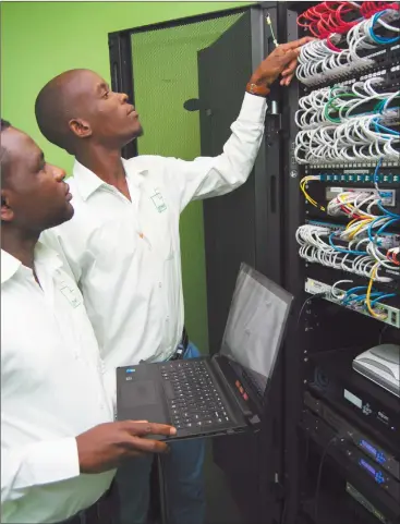 ?? Photo: Contribute­d ?? Embracing ICT… Green IT technician­s working a corporate network.
