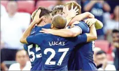  ?? ROSLAN RAHMAN/AFP ?? Harry Kane (right) is congratula­ted by teammates after scoring during the Internatio­nal Champions Cup football match against Juventus in Singapore on Sunday.