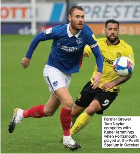  ??  ?? Former Brewer Tom Naylor competes with Kane Hemmings when Portsmouth played at the Pirelli Stadium in October.