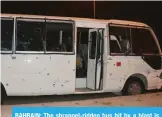  ?? — KUNA ?? BAHRAIN: The shrapnel-ridden bus hit by a blast is seen in this handout photo.