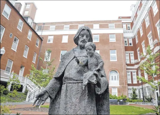  ?? The Associated Press file ?? Mulledy Hall, also known as Freedom Hall, center, is seen on the campus of Georgetown University in 2017. Georgetown plans to raise about $400,000 to help communitie­s that are home to some descendant­s of 272 slaves the school sold in 1838.