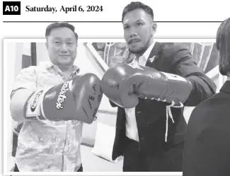  ?? ?? Gloves for Sentol
Paris Olympics-bound Eumir Felix Marcial gifts Senator Francis “Tol” Tolentino the signed gloves he used in knocking out Thailand’s Thoedsak Sinam in the fourth round during their recent fight at the Ninoy Aquino Stadium—his fifth straight victory as a profession­al.