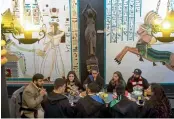  ?? — AFP ?? Students of the School of Magic and Witchcraft have tea in a castle in Campos do Jordao in Sao Paulo, Brazil.