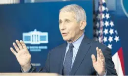  ?? DOUG MILLS/THE NEW YORK TIMES ?? Dr. Anthony Fauci, director of the National Institute of Allergy and Infectious Diseases, addresses reporters about the coronaviru­s pandemic during a briefing at the White House in Washington on Thursday.