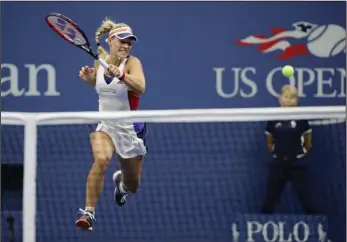  ?? The Associated Press ?? EARLY EXIT: German Angelique Kerber, defending women’s champion at the U.S. Open, loses a first-round match to Japan’s Naomi Osaka on Tuesday in New York.