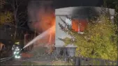  ?? Daily Courier file photo ?? A firefighte­r hoses down a blaze at the Paradise trailer park last Halloween.