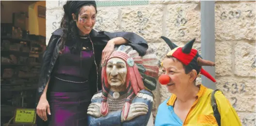  ?? (Marc Israel Sellem/The Jerusalem Post) ?? PEOPLE CELEBRATE Purim in Jerusalem.