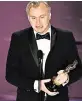  ?? PATRICK T. FALLON AFP/TNS ?? Christophe­r Nolan accepts the award for best director for ‘Oppenheime­r’ at the Dolby Theatre.