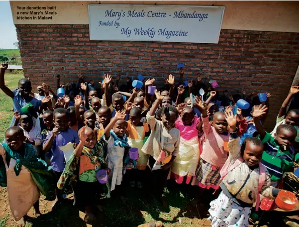  ??  ?? Your donations built a new Mary’s Meals kitchen in Malawi