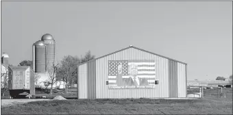  ?? [JOSEPH CRESS/IOWA CITY PRESS-CITIZEN] ?? An image of President Donald Trump is seen on the side of a barn Nov. 1 at a farm in Johnson County, Iowa.